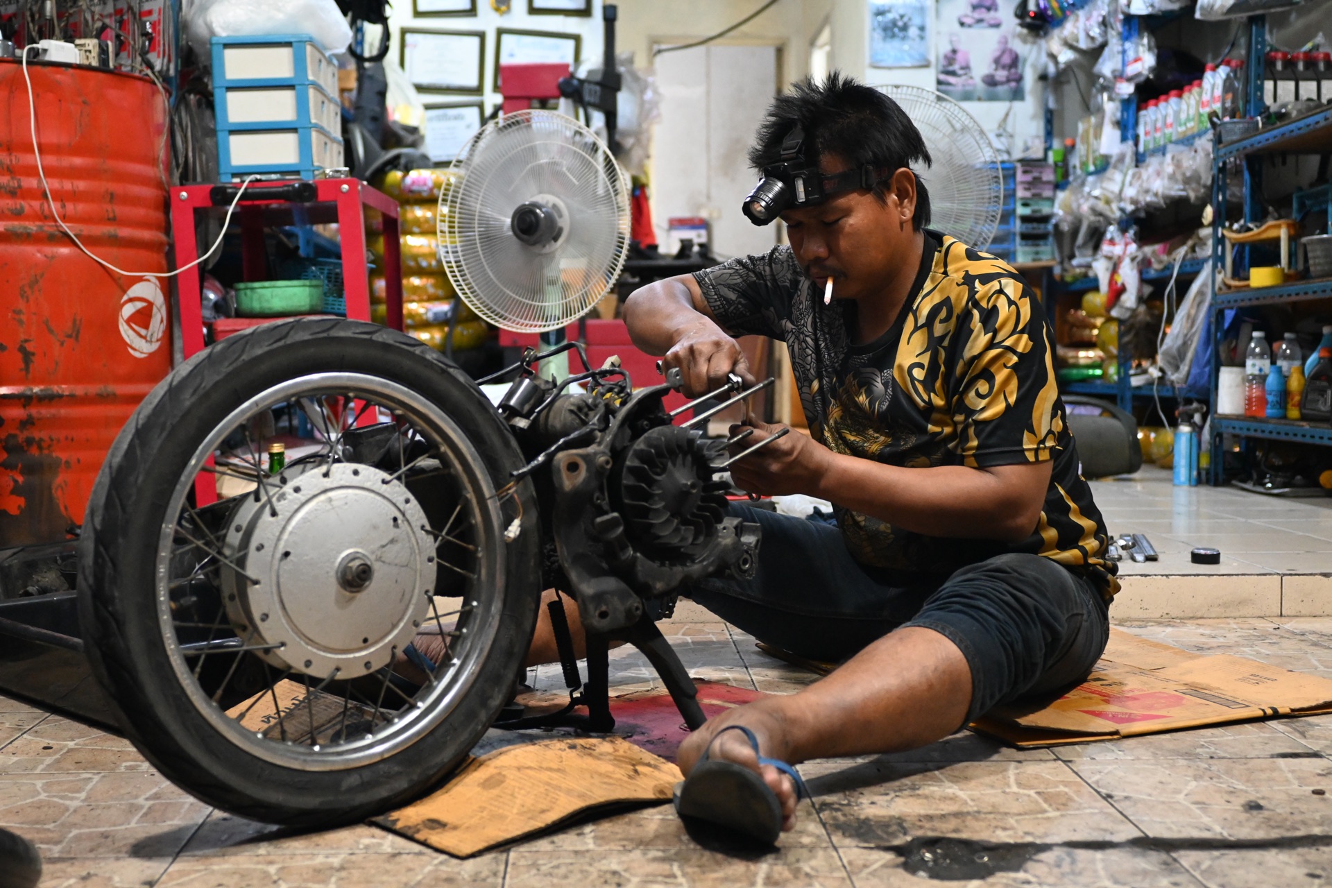 Mechanic working on a motorbike